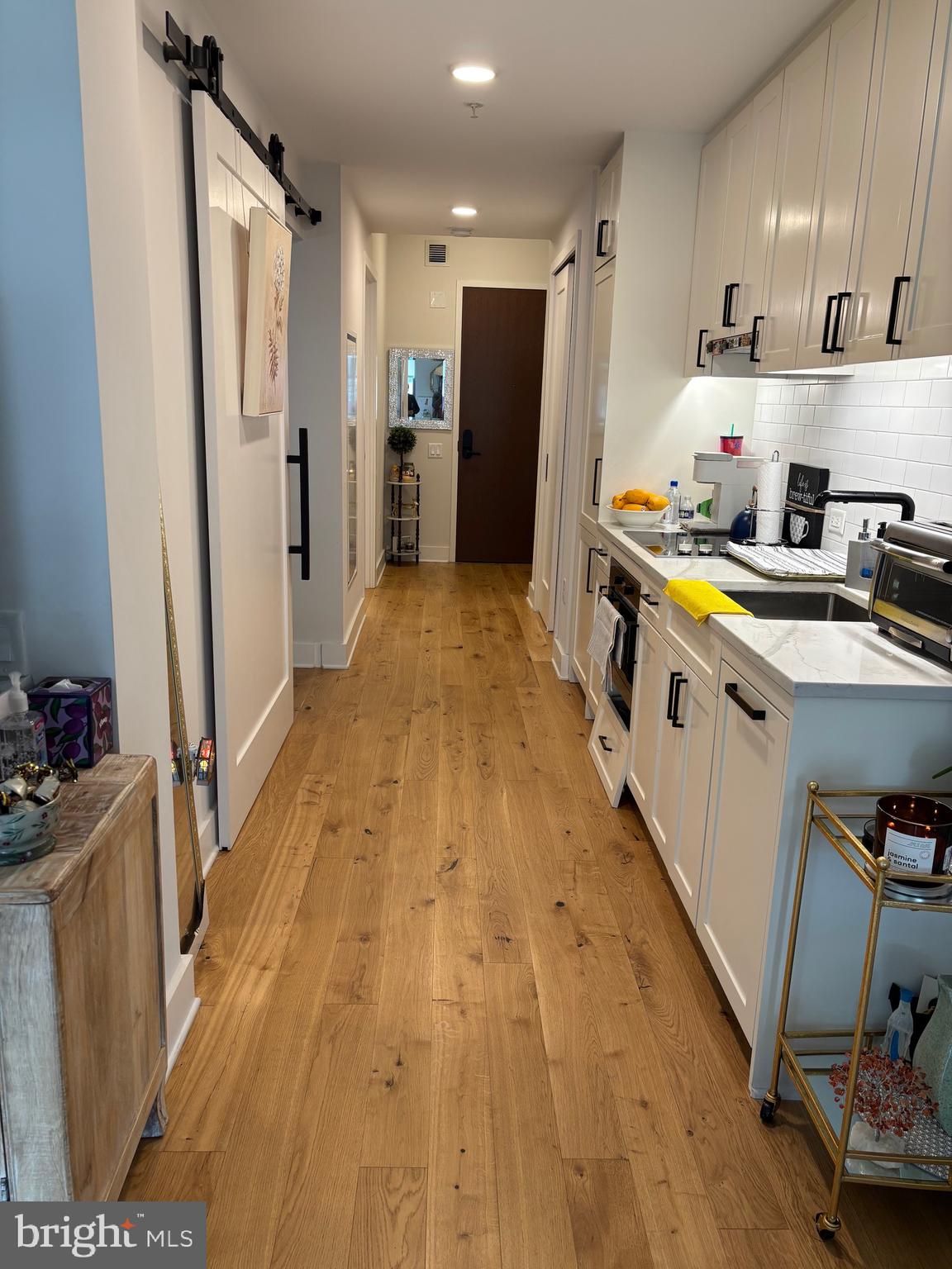 1211 Van Street Southeast, Unit 310 Washington, DC 20003 - Photo 20 of 49 hall to kitchen