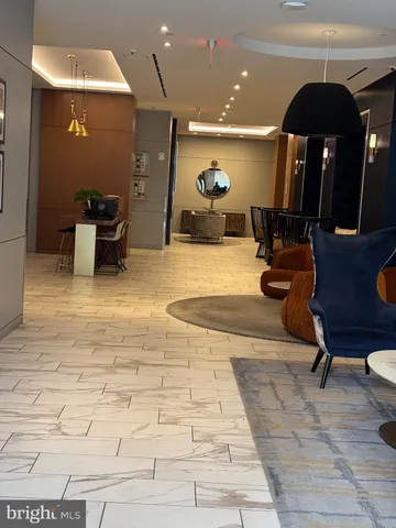 a living room with furniture and a dining table