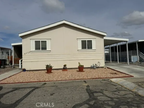 a front view of a house with two windows