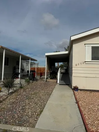 a view of a porch with furniture and backyard