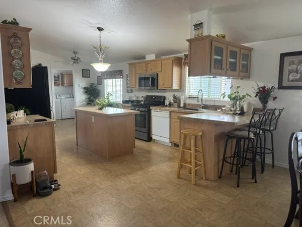 a view of a livingroom with furniture and window