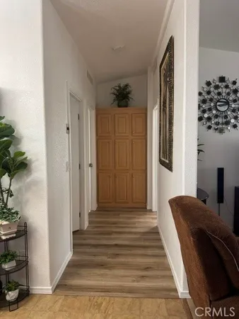 a kitchen with stainless steel appliances granite countertop a sink a stove a microwave a counter space and cabinets