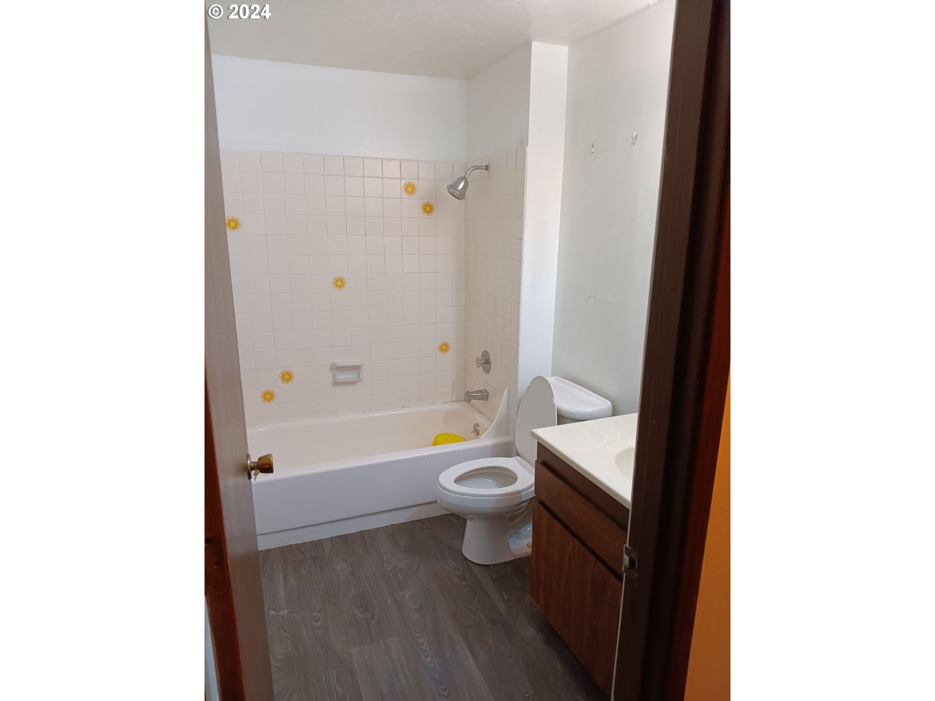 5324 B Street Springfield, OR 97478 - Photo 7 of 13 a bathroom with a granite countertop toilet a sink and bathtub