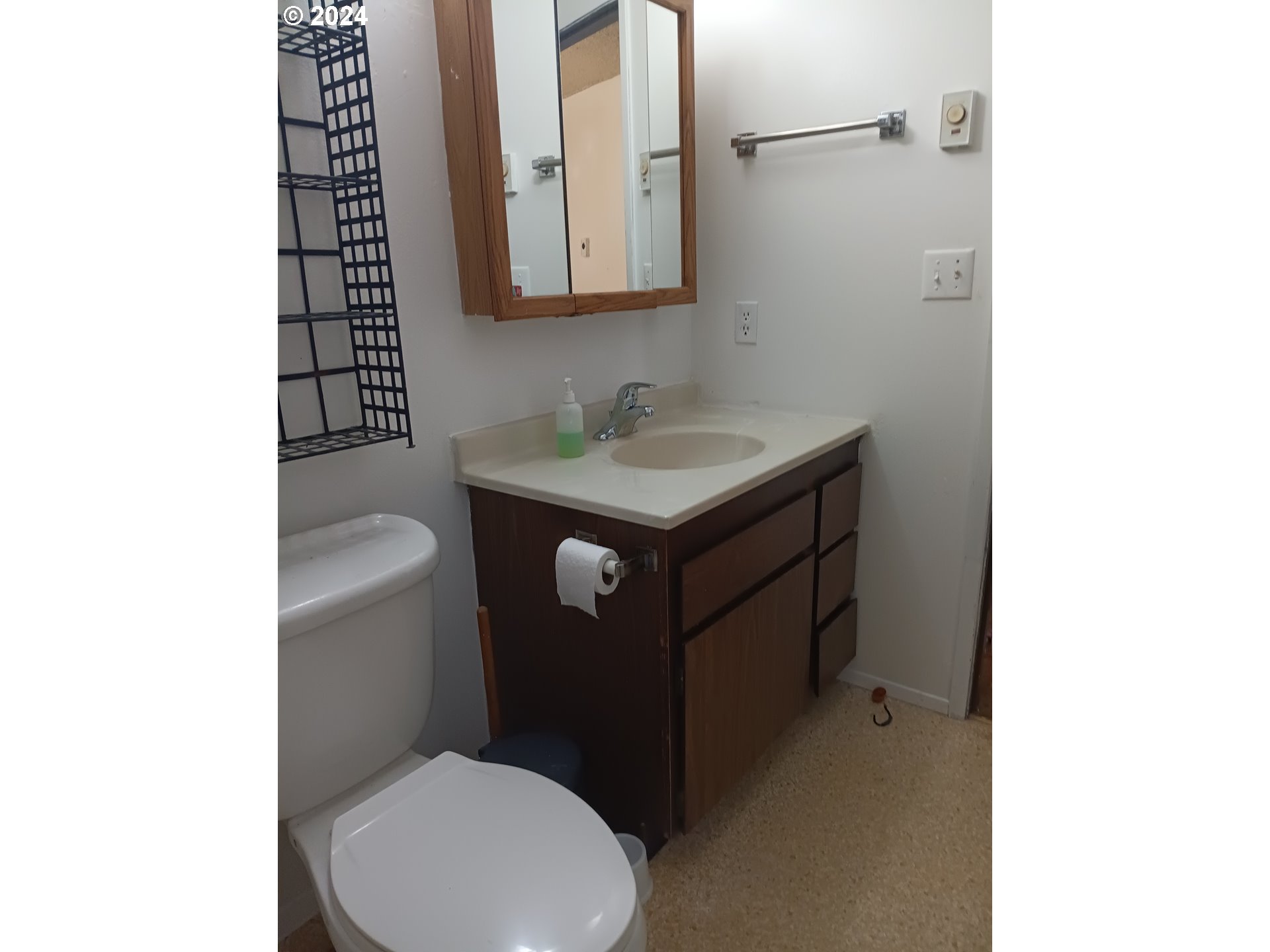 5324 B Street Springfield, OR 97478 - Photo 8 of 13 a bathroom with a sink a toilet and mirror