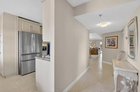 a kitchen with stainless steel appliances a refrigerator and a stove top oven