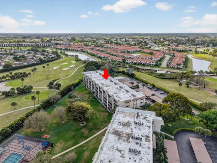 an aerial view of a house with a lake view