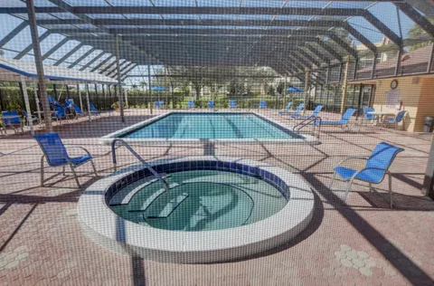 a view of a swimming pool with a patio