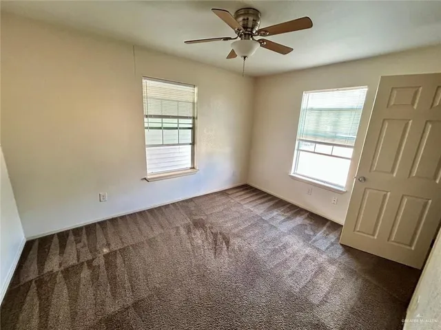 a view of an empty room and window