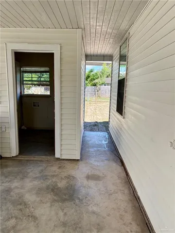 a view of an empty room and window