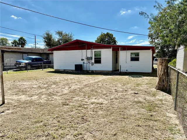 a view of a house with a snow in the yard