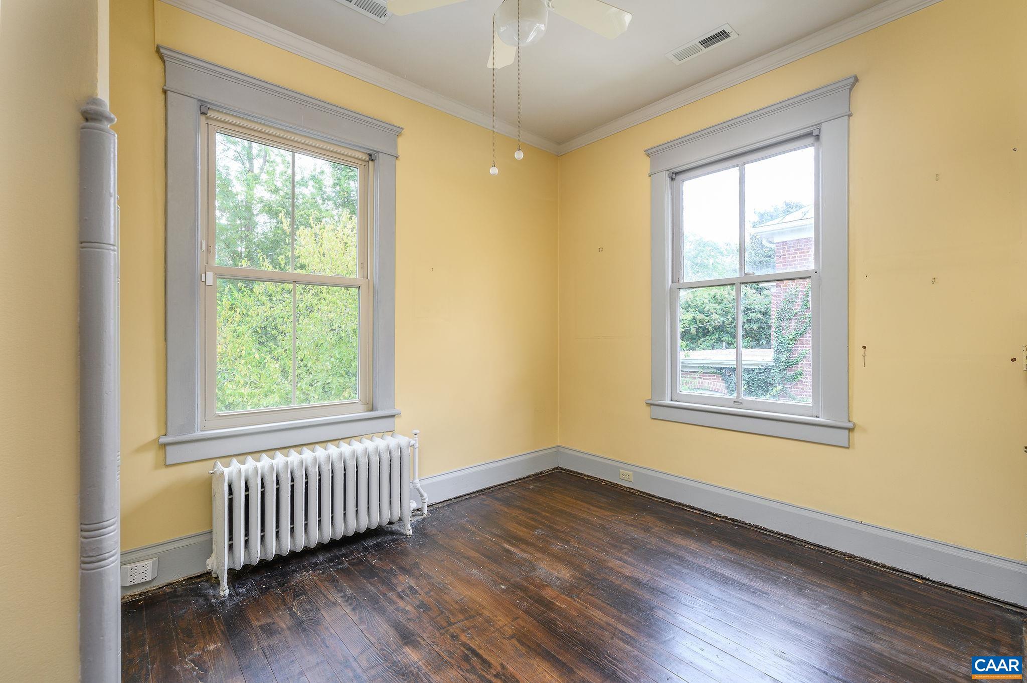 113 Altamont Circle Charlottesville, VA 22902 - Photo 23 of 43 a view of an empty room with wooden floor and a window