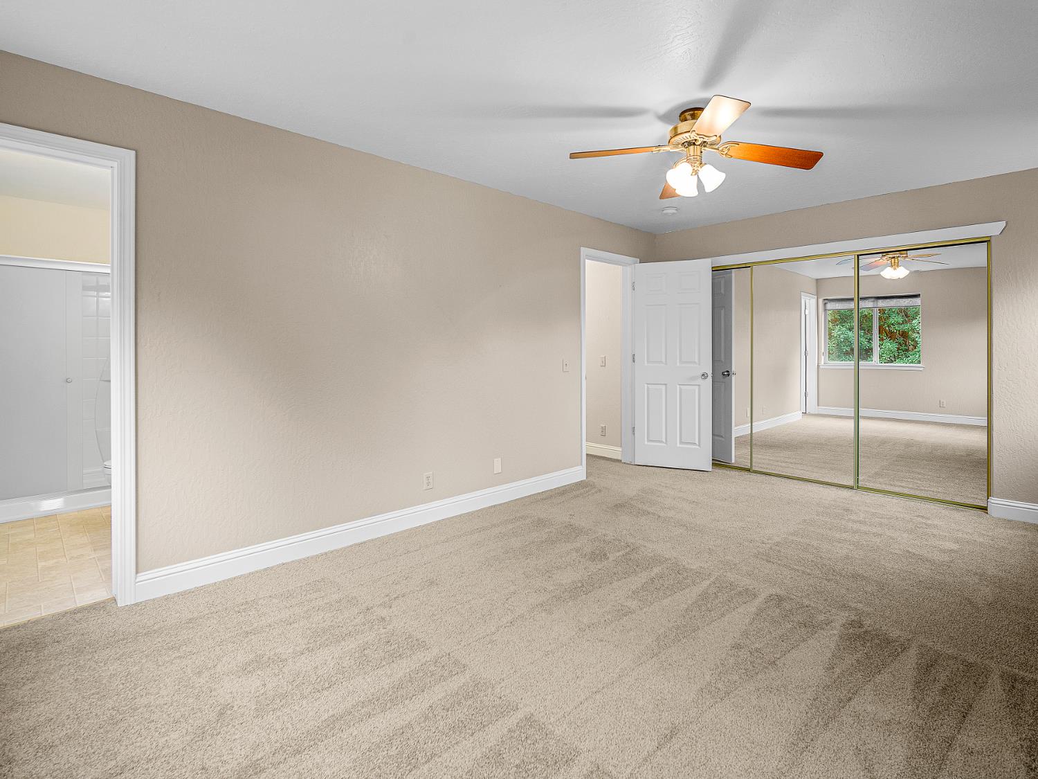 2639 Gold Court Placerville, CA 95667 - Photo 11 of 73 a view of an empty room with window and chandelier fan