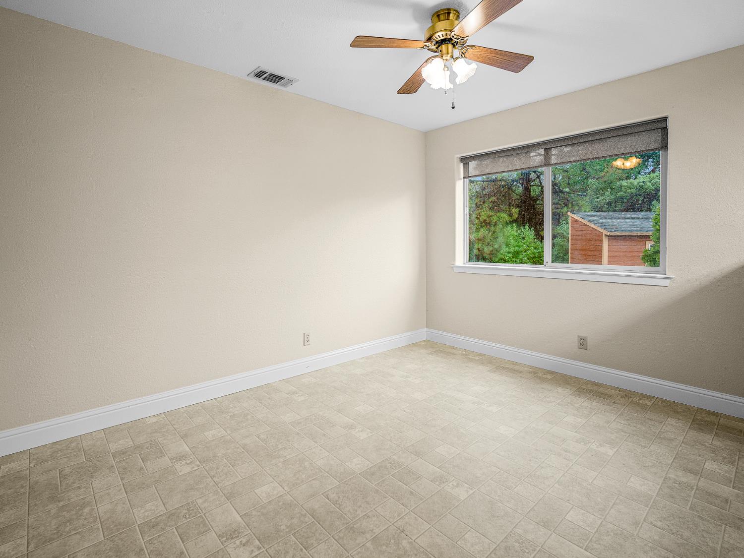 2639 Gold Court Placerville, CA 95667 - Photo 18 of 73 an empty room with a window and a fan