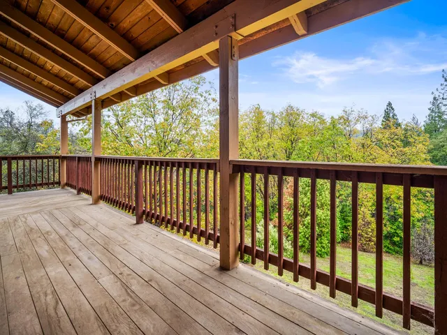 a view of balcony with wooden floor