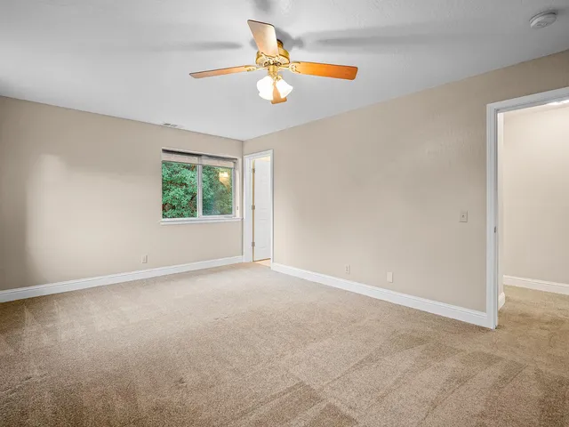 a view of an empty room with a window