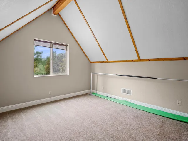 a view of an empty room with windows