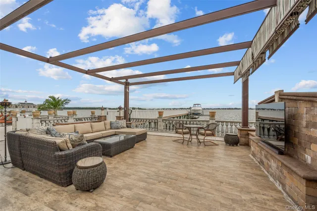 a living room with furniture a fireplace and city view