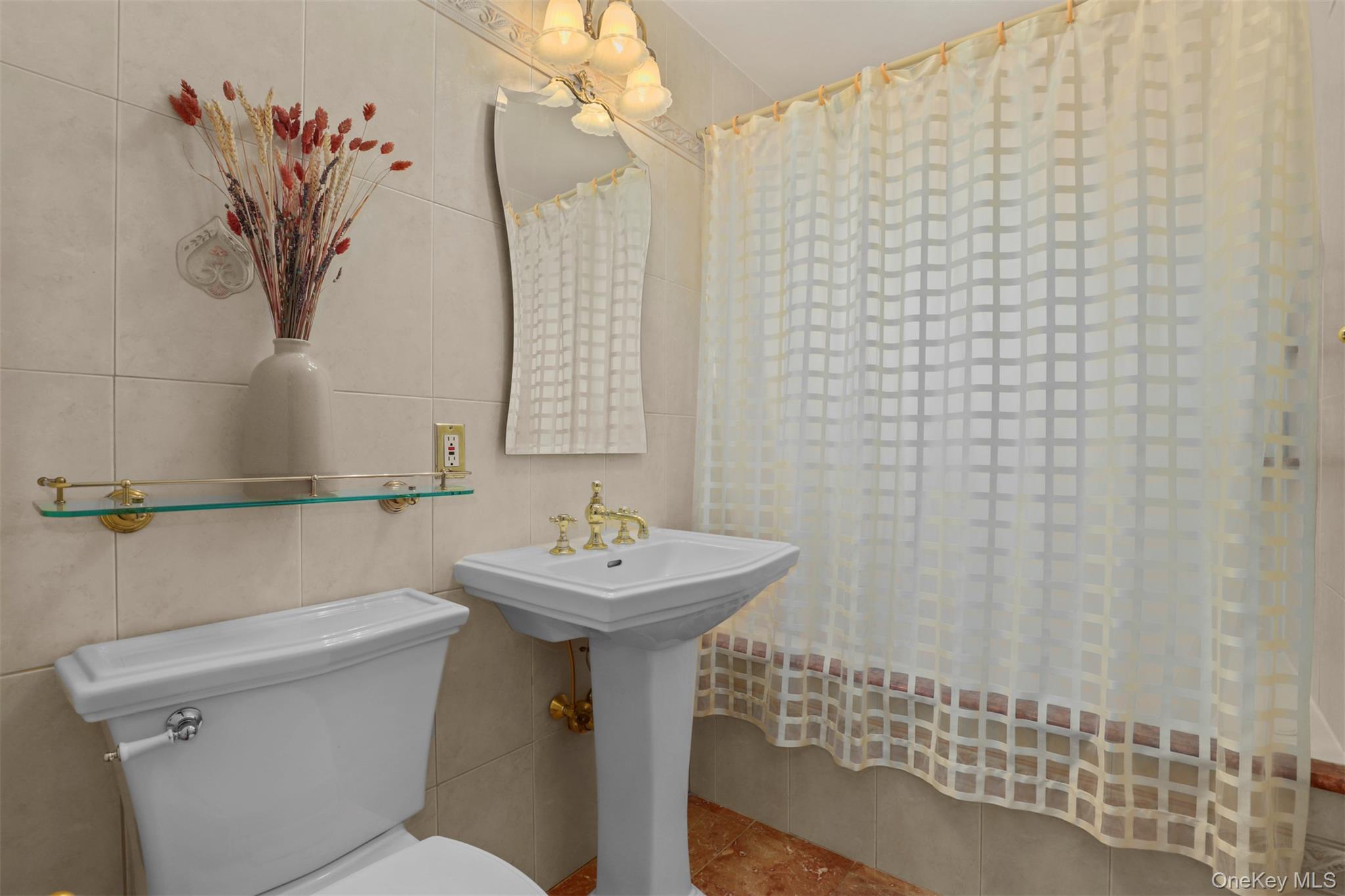 3407 Country Club Road Bronx, NY 10465 - Photo 29 of 34 Bathroom featuring a sink, toilet, tile walls, and tile patterned flooring