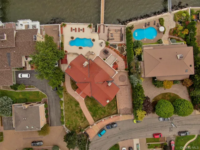 an aerial view of residential house with outdoor space and parking