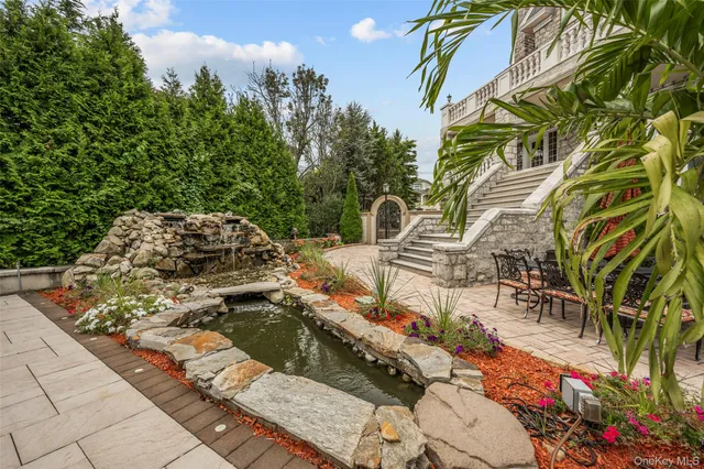 a view of a backyard with sitting area