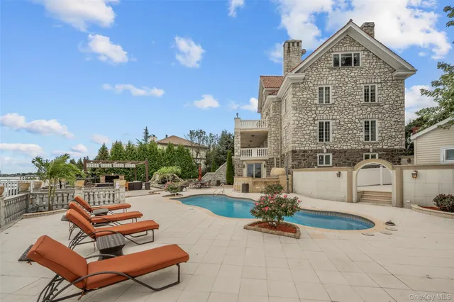 a view of a patio with swimming pool