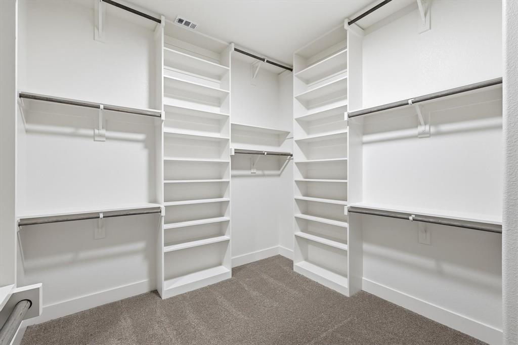 6412 Rigel Road Godley, TX 76044 - Photo 28 of 38 a view of walk in closet with empty racks