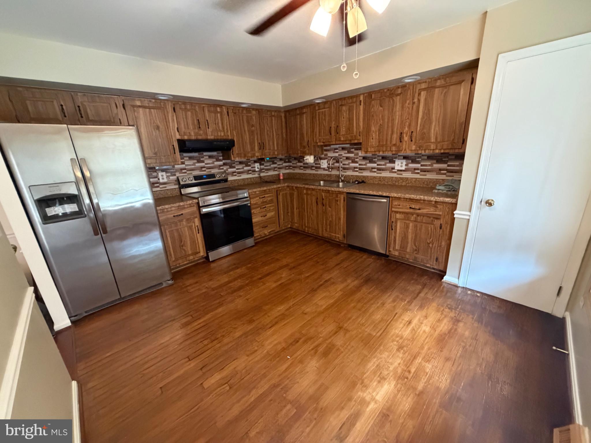 2861 Ridge Road Waldorf, MD 20603 - Photo 26 of 49 Modern kitchen with warm wood tones.