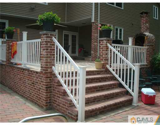19 Frances Road Edison, NJ 08820 - Photo 2 of 6 a view of a house with wooden deck and floor to ceiling window