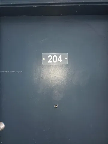 a view of an empty room and wooden floor