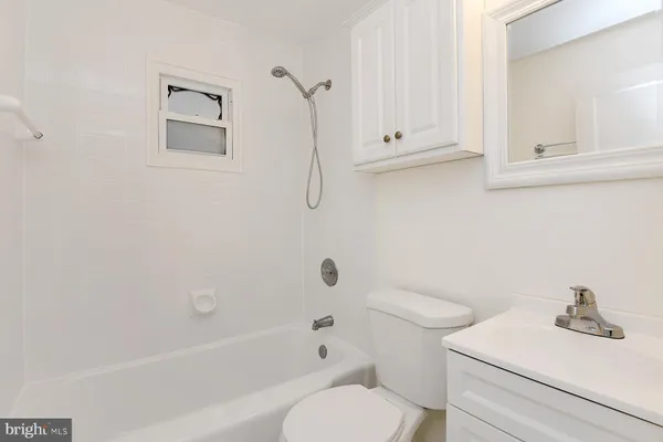 a bathroom with a sink a toilet and a bathtub