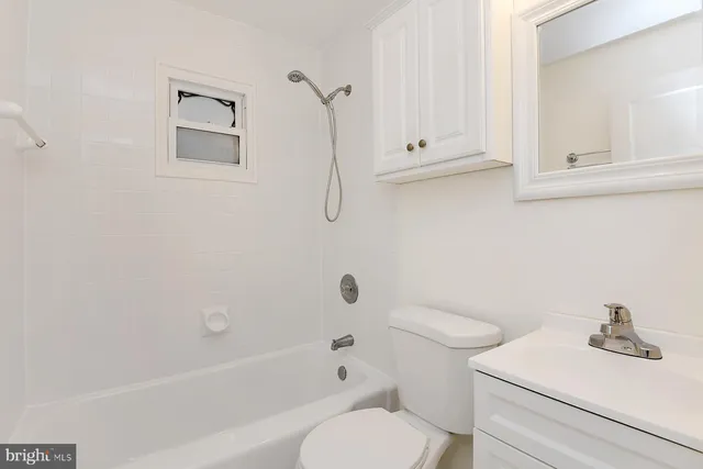 a bathroom with a sink a toilet and a bathtub