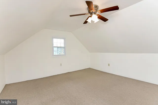 a view of a hallway with white walls