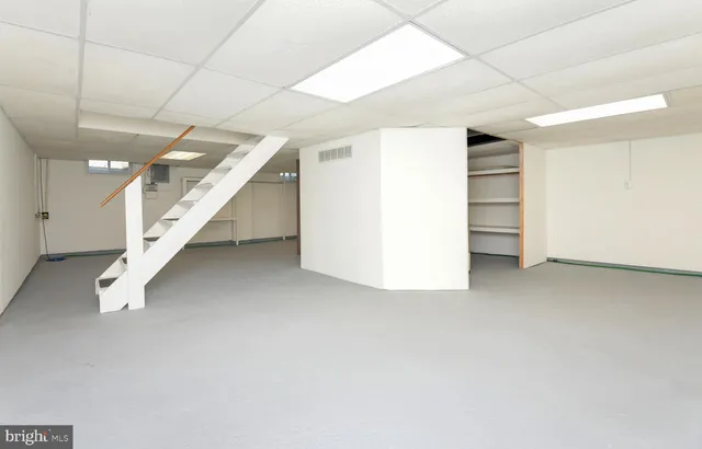 a front view of house with a garden