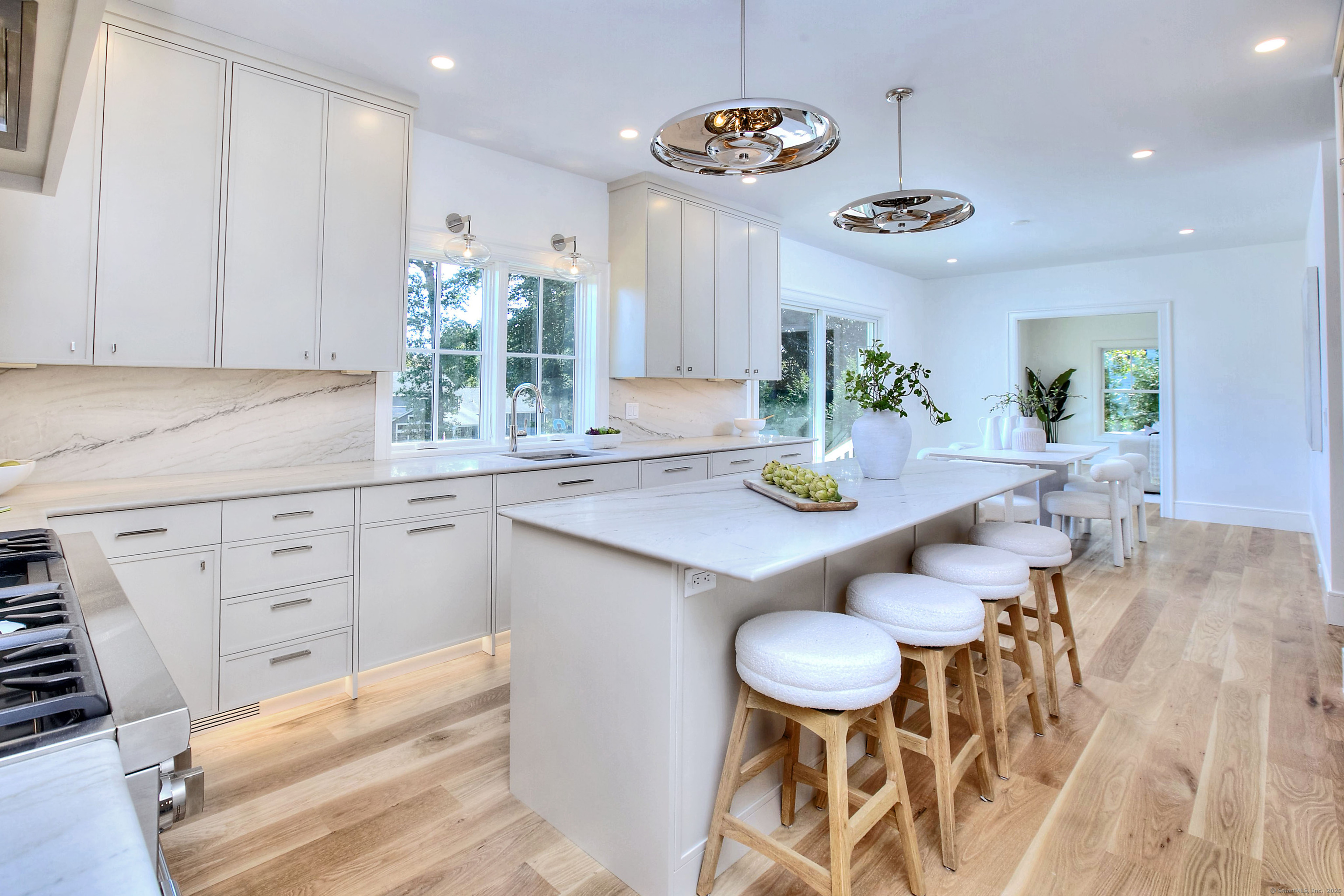 3 Hickory Hill Road Westport, CT 06880 - Photo 14 of 34 a kitchen with a table and chairs in it