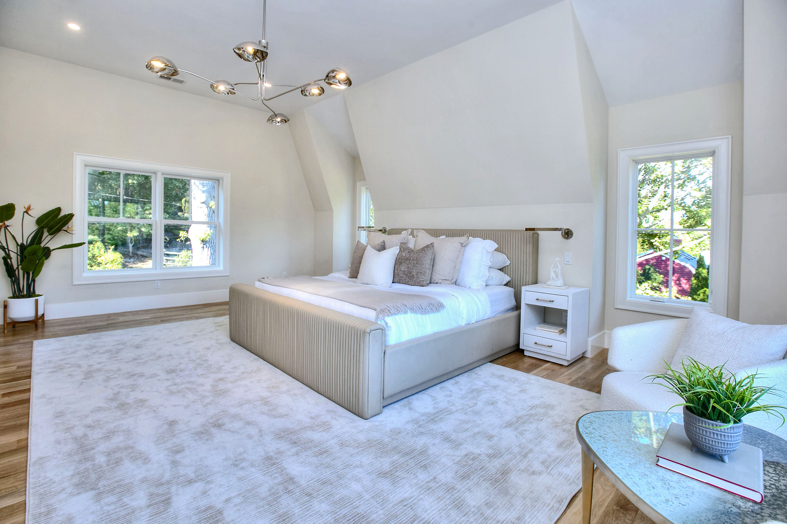 3 Hickory Hill Road Westport, CT 06880 - Photo 19 of 34 a spacious bedroom with a bed and a couch