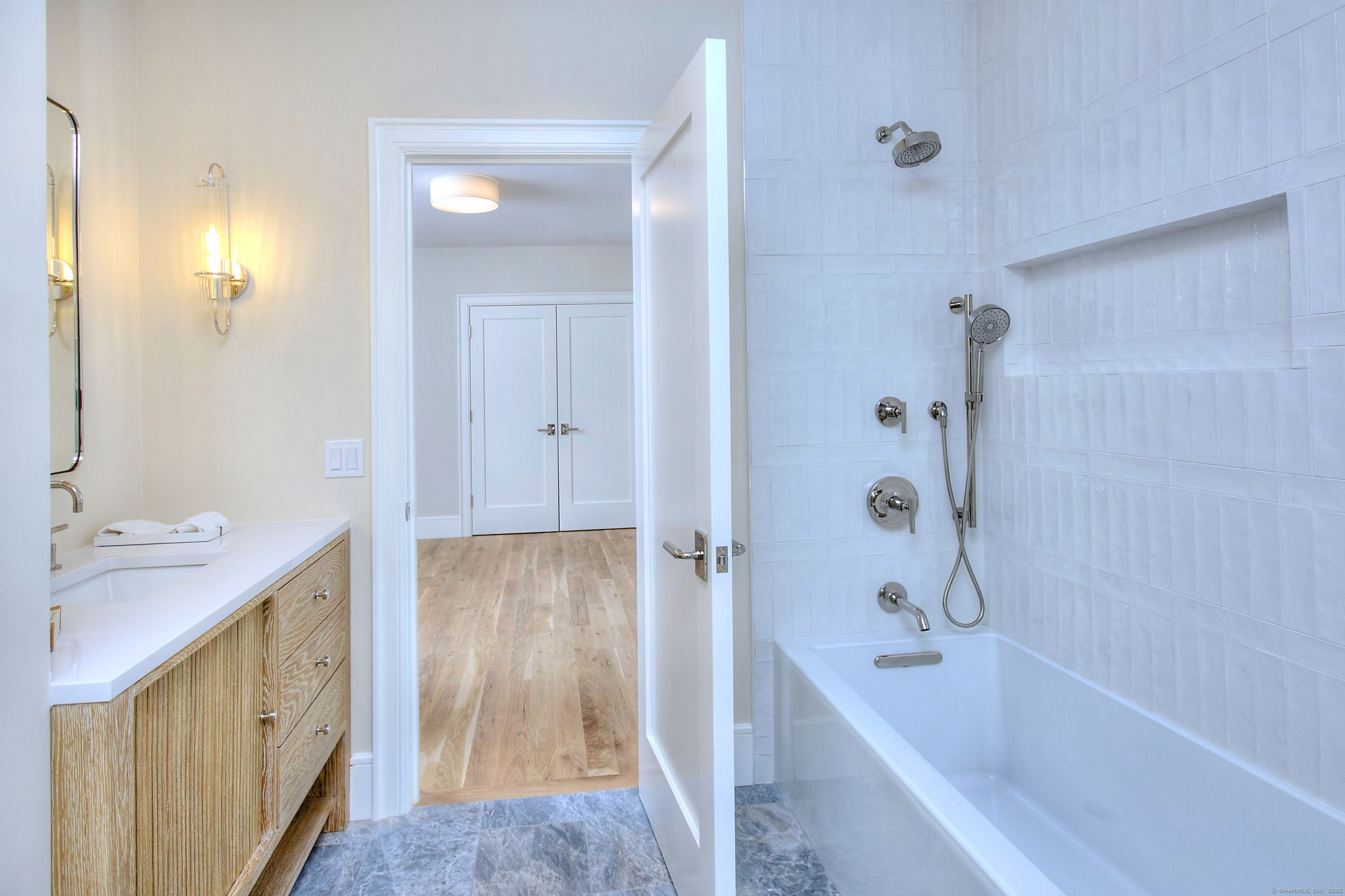 3 Hickory Hill Road Westport, CT 06880 - Photo 25 of 34 a bathroom with a tub sink and mirror