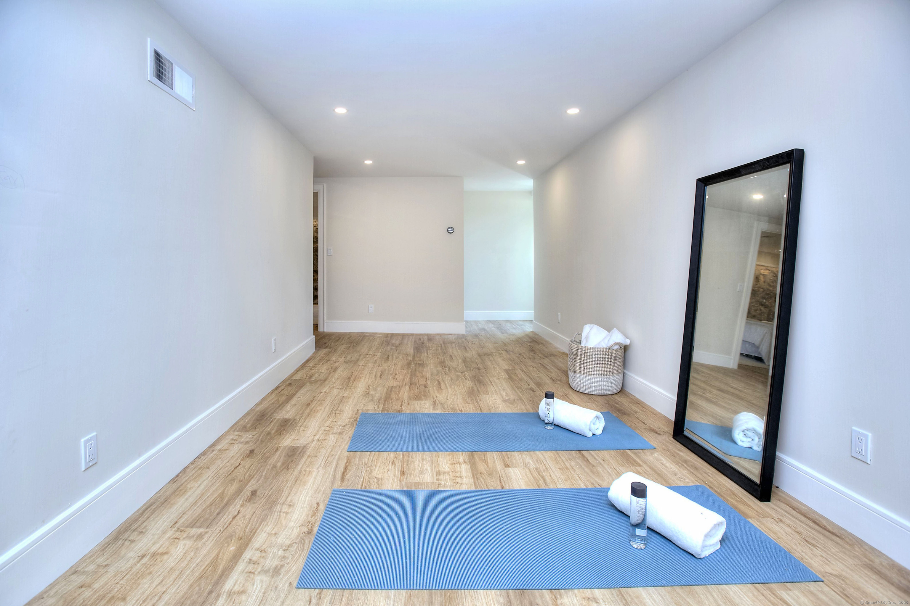 3 Hickory Hill Road Westport, CT 06880 - Photo 30 of 34 a room with wooden floor and glass door