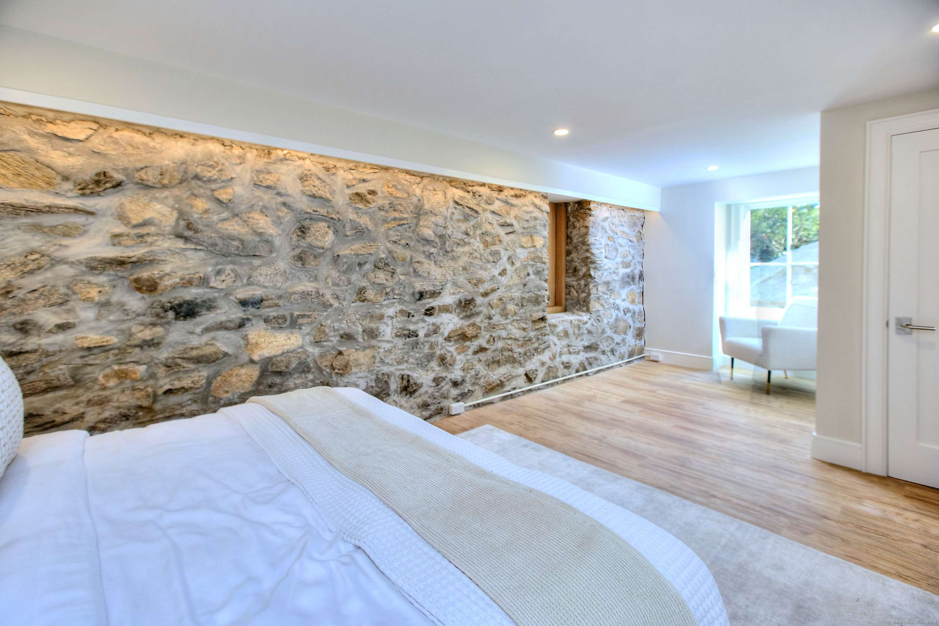 3 Hickory Hill Road Westport, CT 06880 - Photo 33 of 34 a spacious bedroom with a large bed and a large window