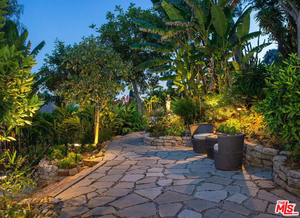 3116-unit A Johnston Street Los Angeles, CA 90031 - Photo 13 of 13 a view of a garden with plants and a bench