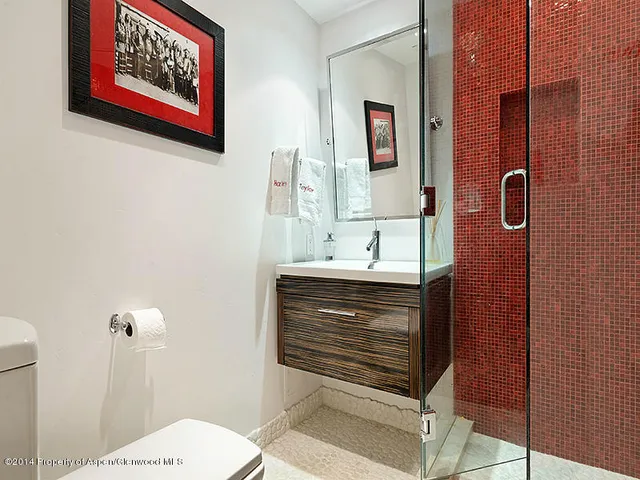 a bathroom with a sink and mirror