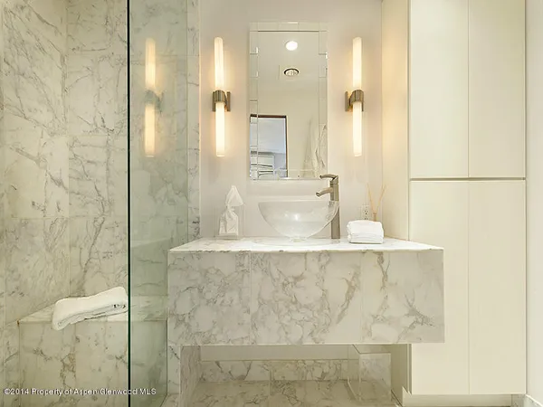 a bathroom with a bathtub and shower