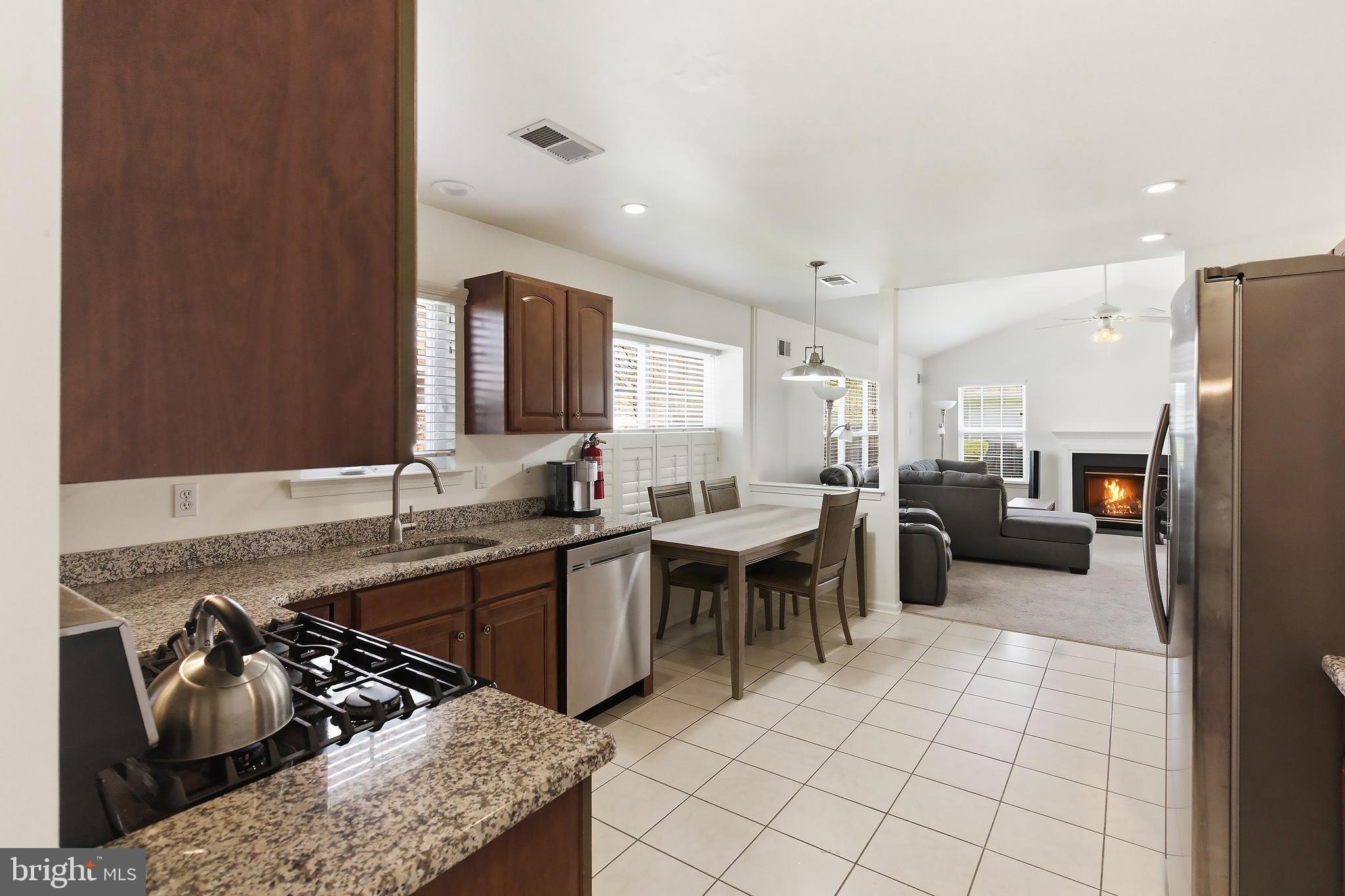 7 Ivy Hill Road Lakewood, NJ 08701 - Photo 15 of 51 a kitchen with stainless steel appliances granite countertop a sink and a refrigerator