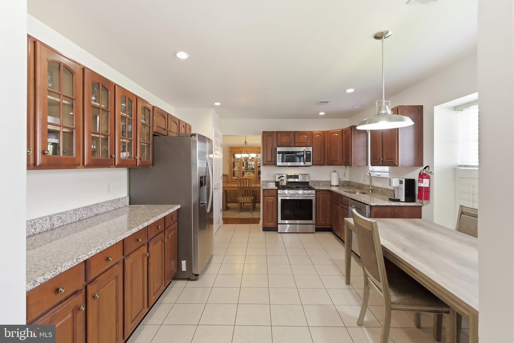 7 Ivy Hill Road Lakewood, NJ 08701 - Photo 16 of 51 a kitchen with stainless steel appliances granite countertop a refrigerator and stove