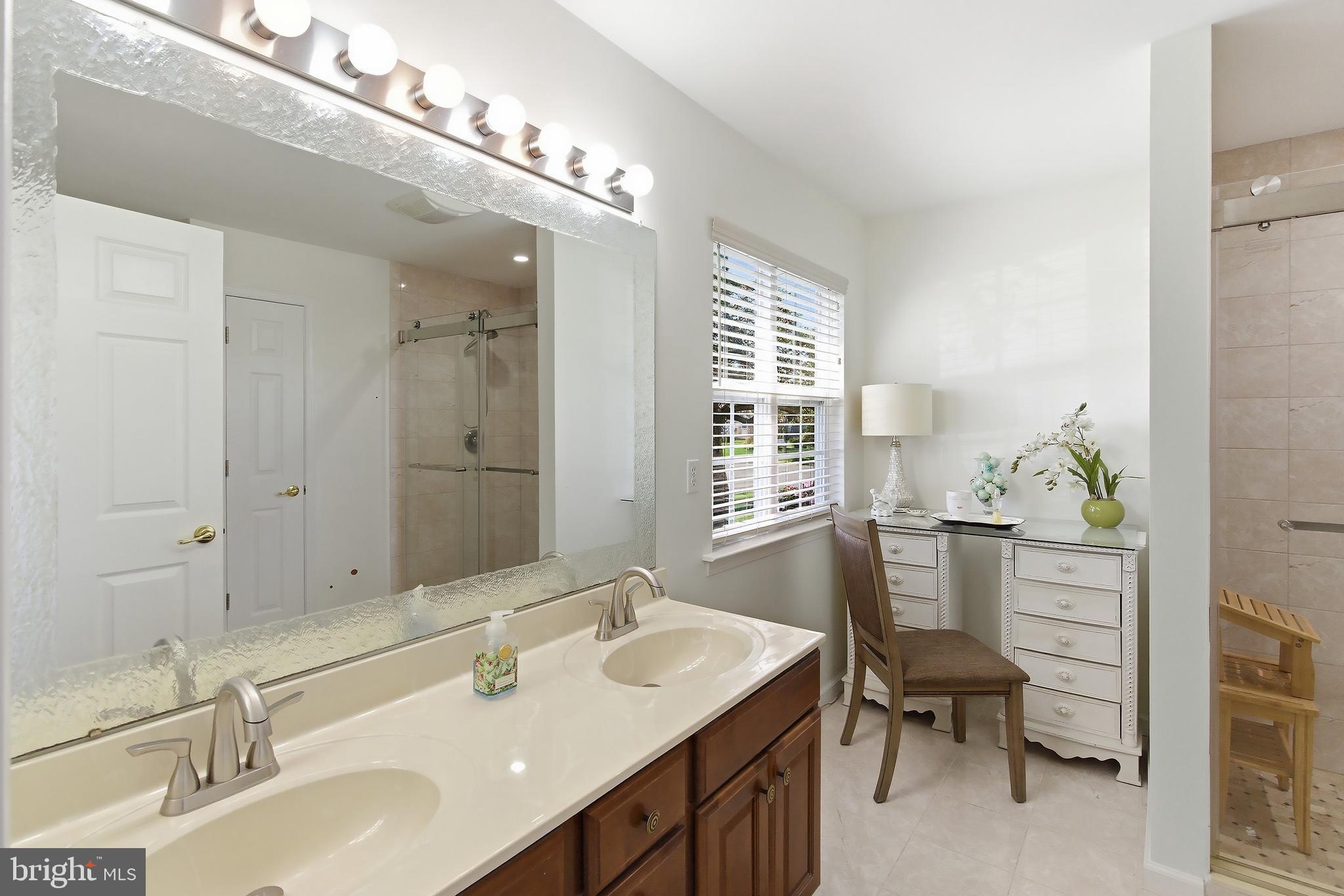7 Ivy Hill Road Lakewood, NJ 08701 - Photo 23 of 51 a bathroom with a sink double vanity and a bathtub
