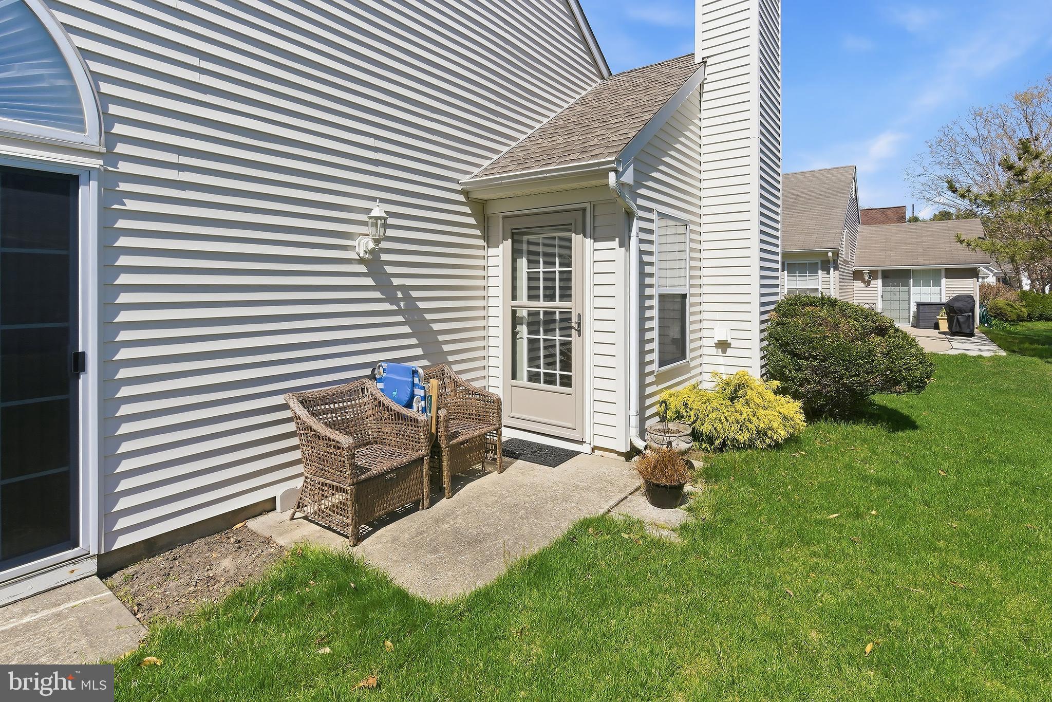 7 Ivy Hill Road Lakewood, NJ 08701 - Photo 30 of 51 a house view with a garden and outdoor seating