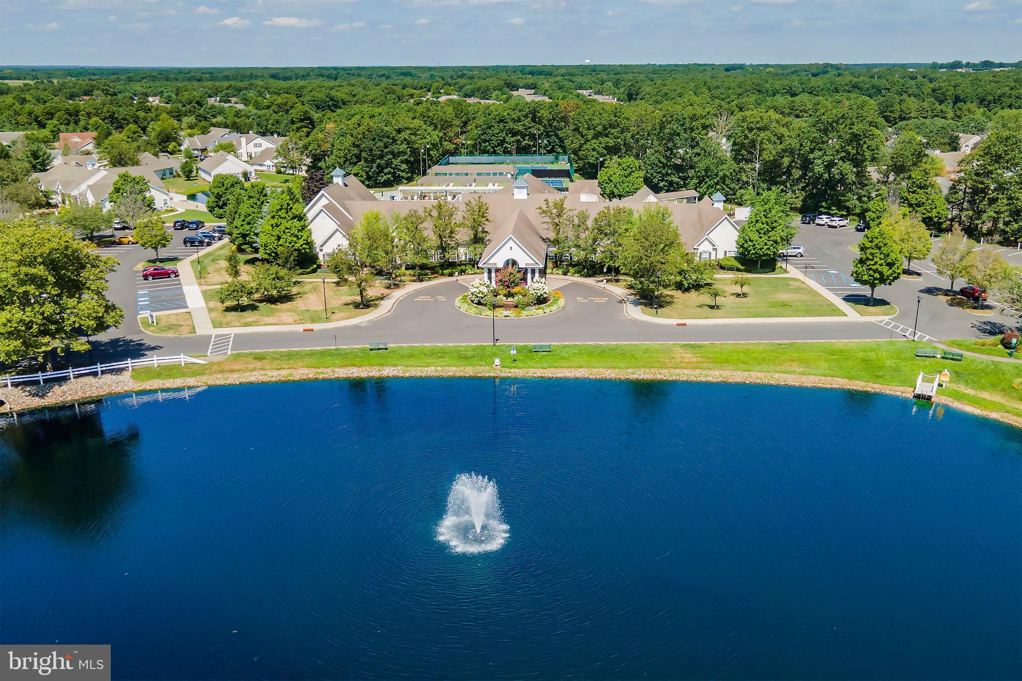 7 Ivy Hill Road Lakewood, NJ 08701 - Photo 34 of 51 a view of a lake with lawn chairs and large trees