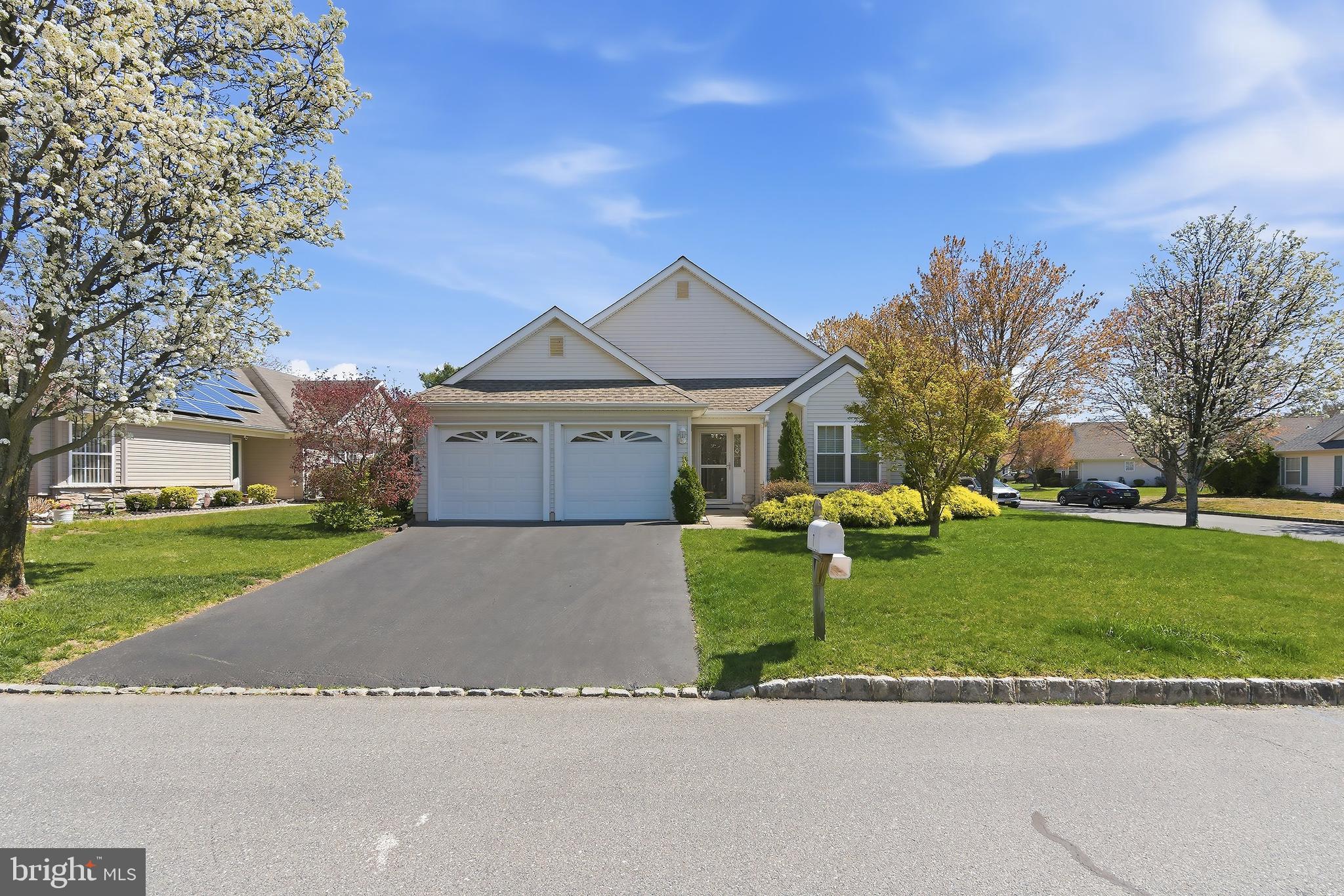 7 Ivy Hill Road Lakewood, NJ 08701 - Photo 4 of 51 a front view of a house with a yard and garage