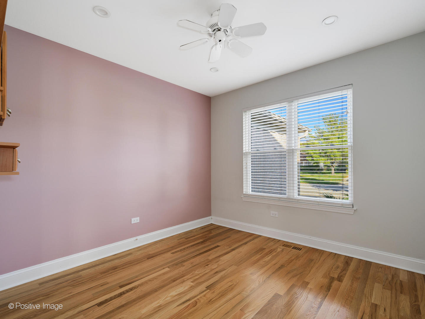 2008 Clematis Drive Algonquin, IL 60102 - Photo 12 of 25 a view of an empty room with window and a chandelier fan