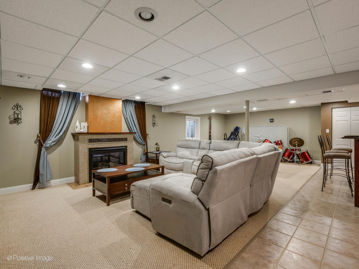 2008 Clematis Drive Algonquin, IL 60102 - Photo 18 of 25 a living room with furniture a fireplace and a flat screen tv