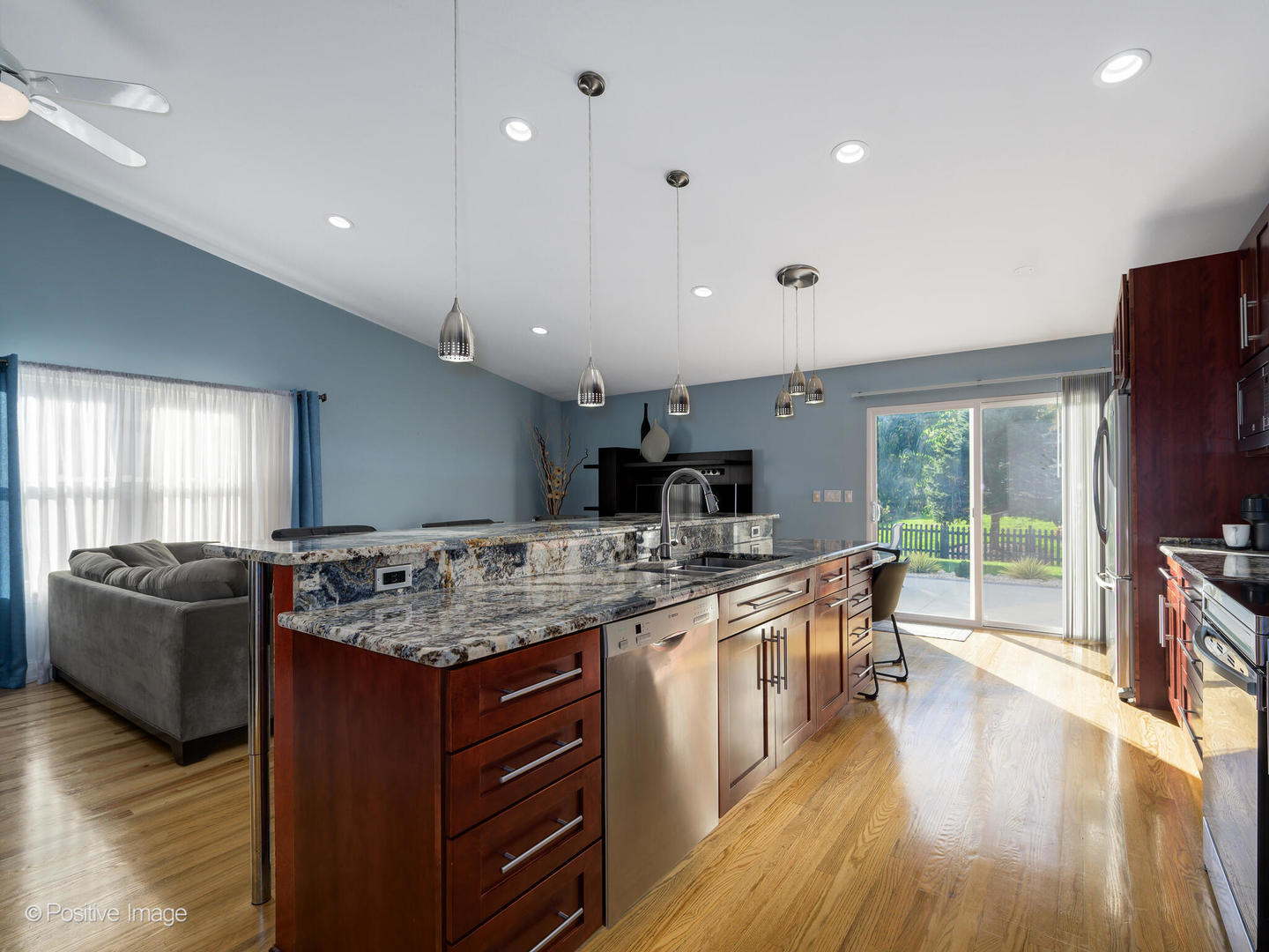 2008 Clematis Drive Algonquin, IL 60102 - Photo 8 of 25 a kitchen with stainless steel appliances granite countertop a sink stove and wooden floor